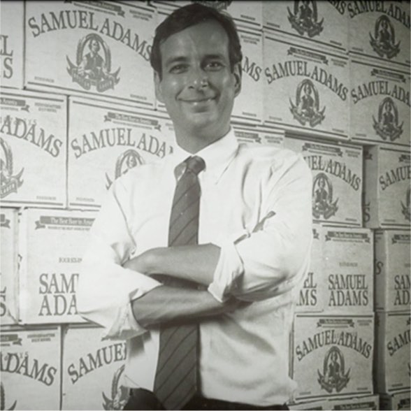 Young Jim Koch poses with cases of Sam Adams