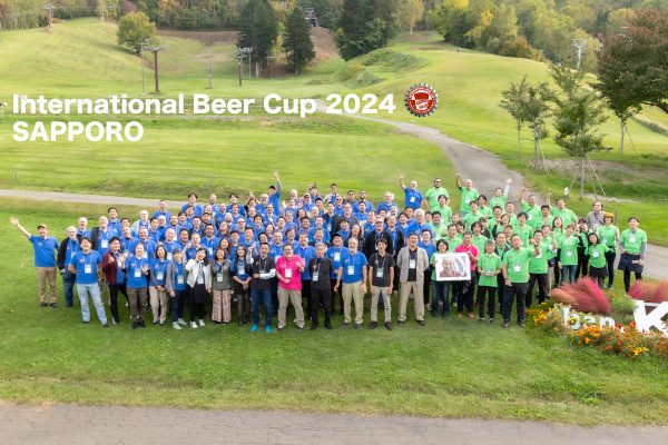 international beer cup judges posed together in pastoral scene