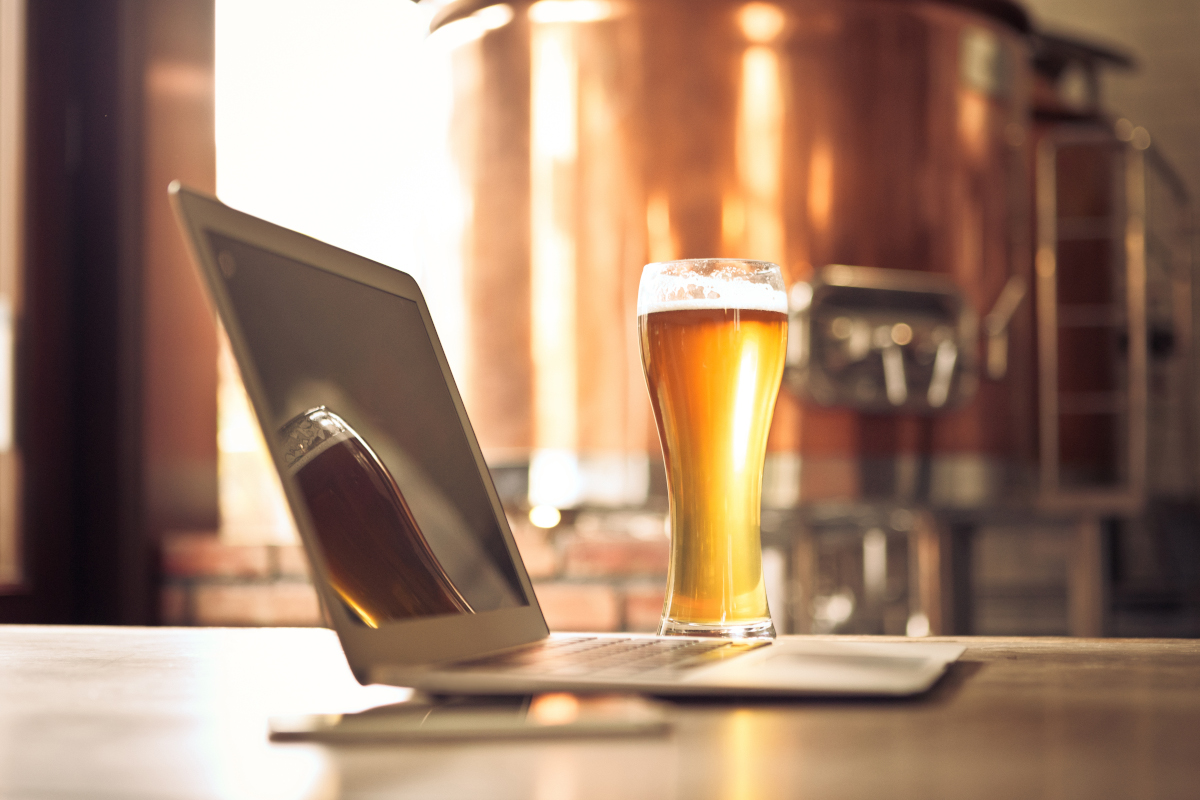 beer and computer in a brewery setting