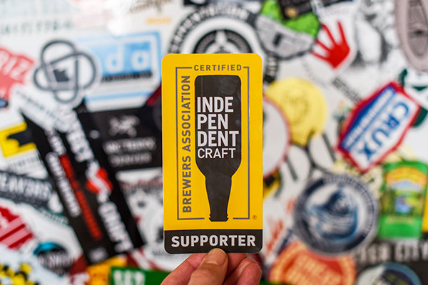 indepdendent seal logo held over brewery logos