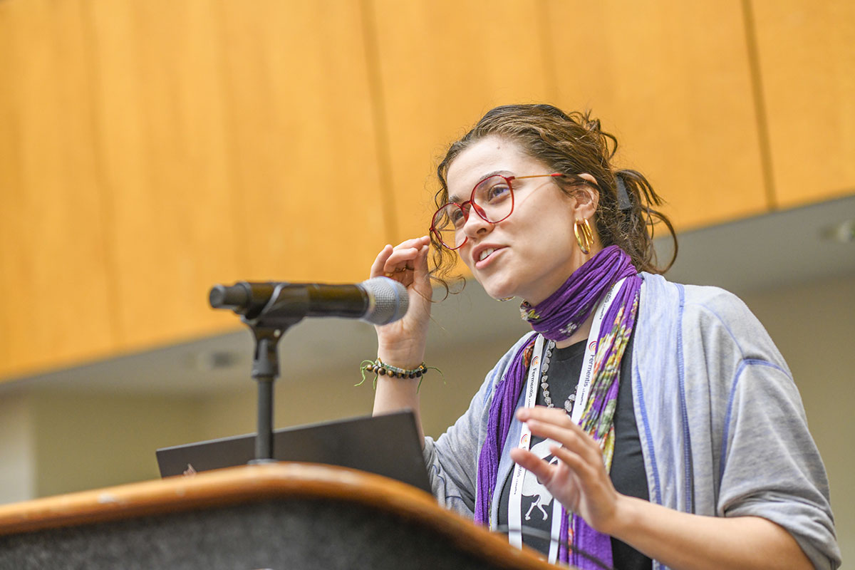 speaker giving presentation at conference