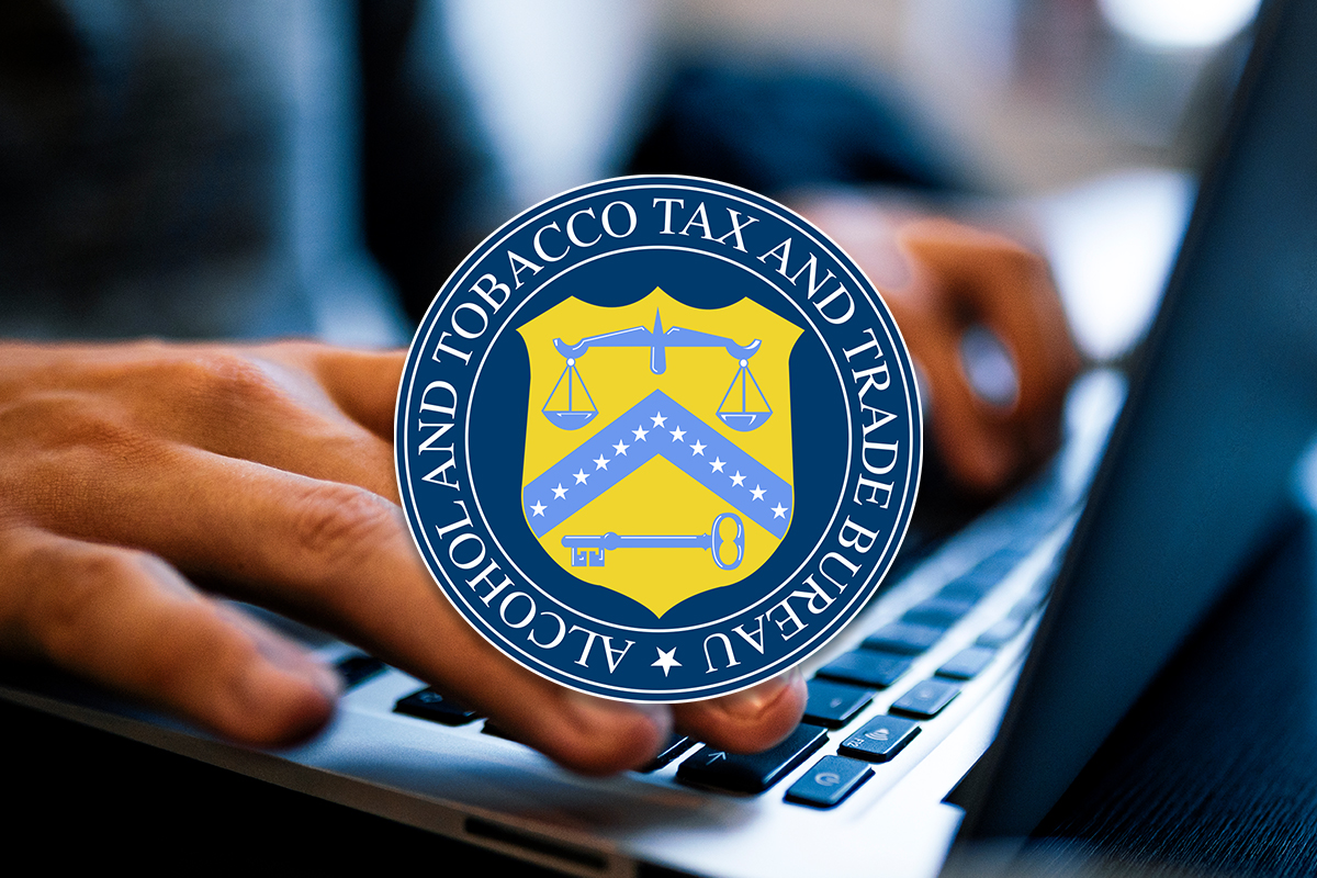 hands working at computer with TTB logo overlaid