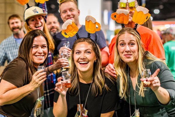 women wearing funny beer hats having fun at the great american beer festival