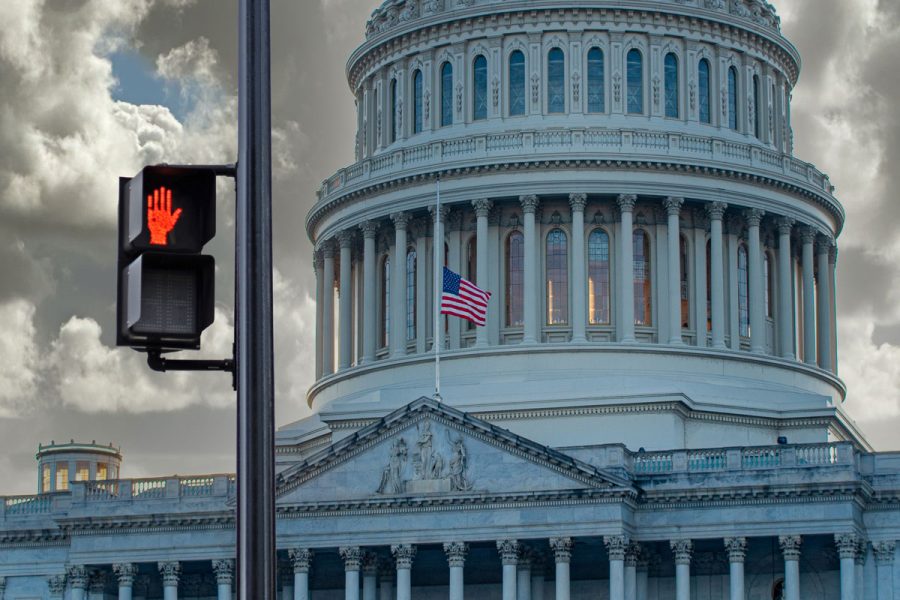 Exterior of U.S. Capitol with don't walk pedestrian sign