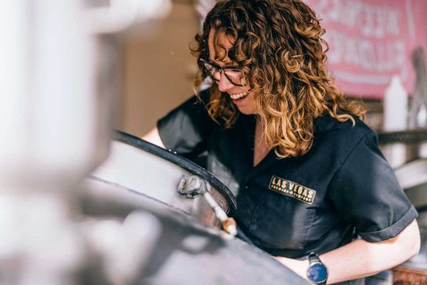 Woman smiling while brewing