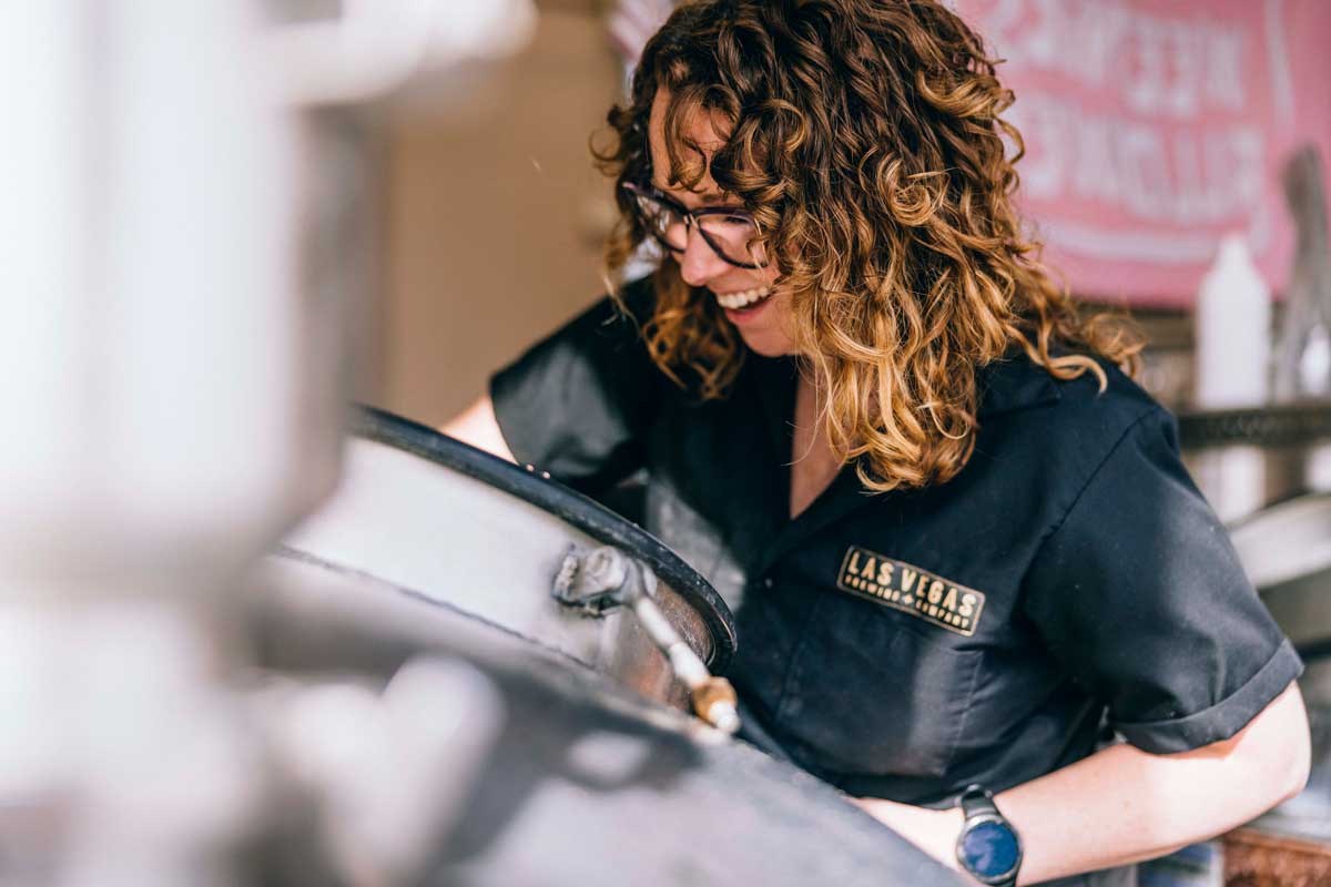 Woman smiling while brewing