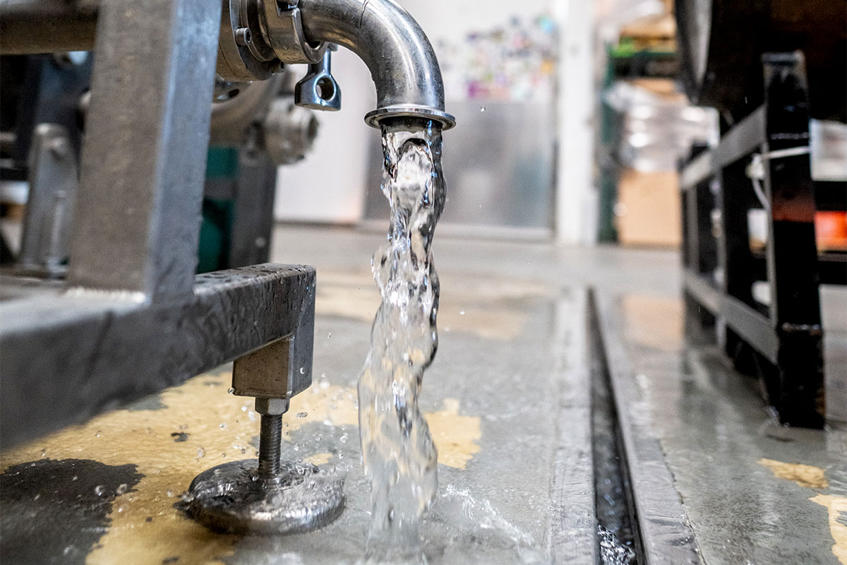Water running from spigot in brewery