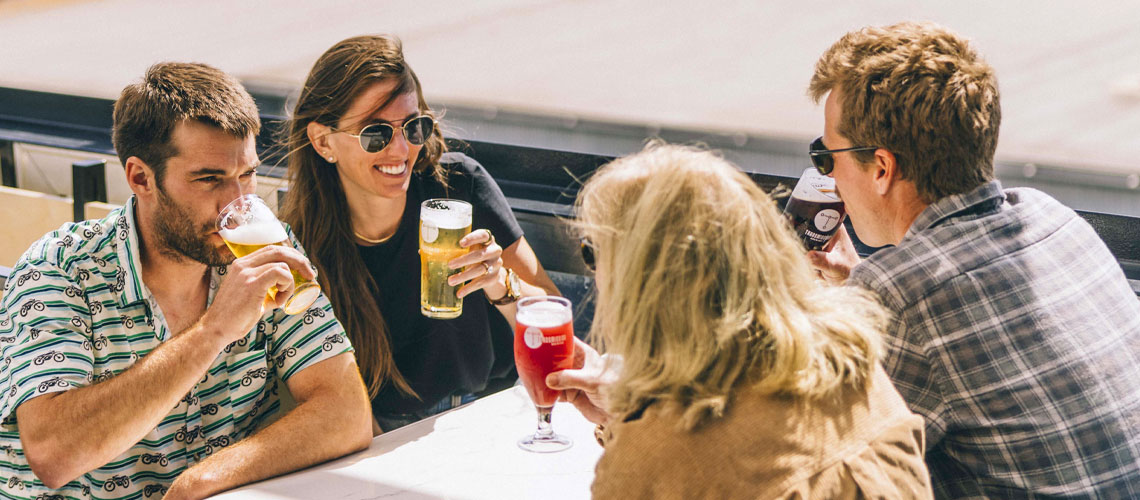 Taproom patrons enjoying beer outside