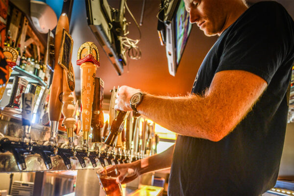 Pouring beers at a bar