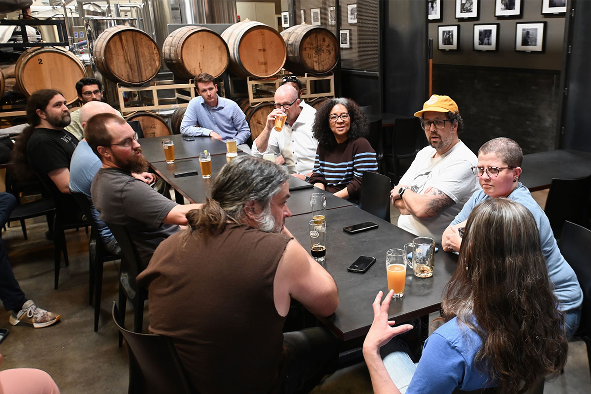 Congresswoman Marilyn Strickland seated at a table at Well 80 Brewhouse in Olympia