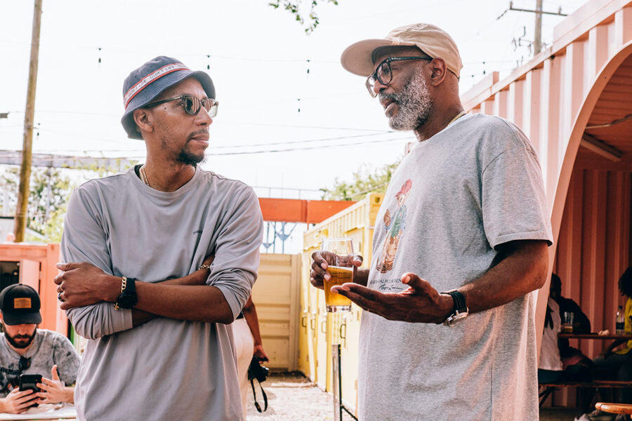 Two men chatting at a brewery