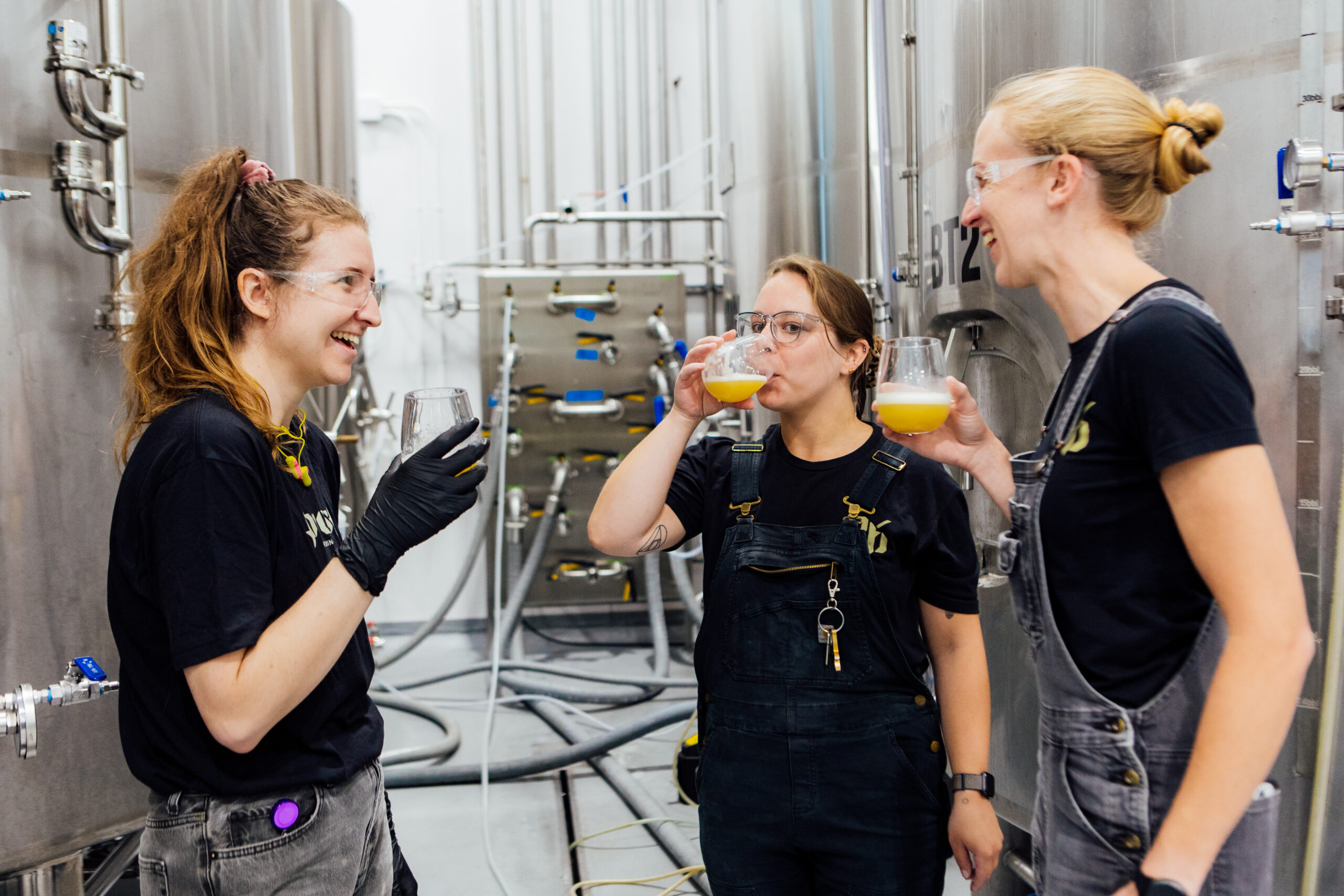 woman brew team beer sample talking